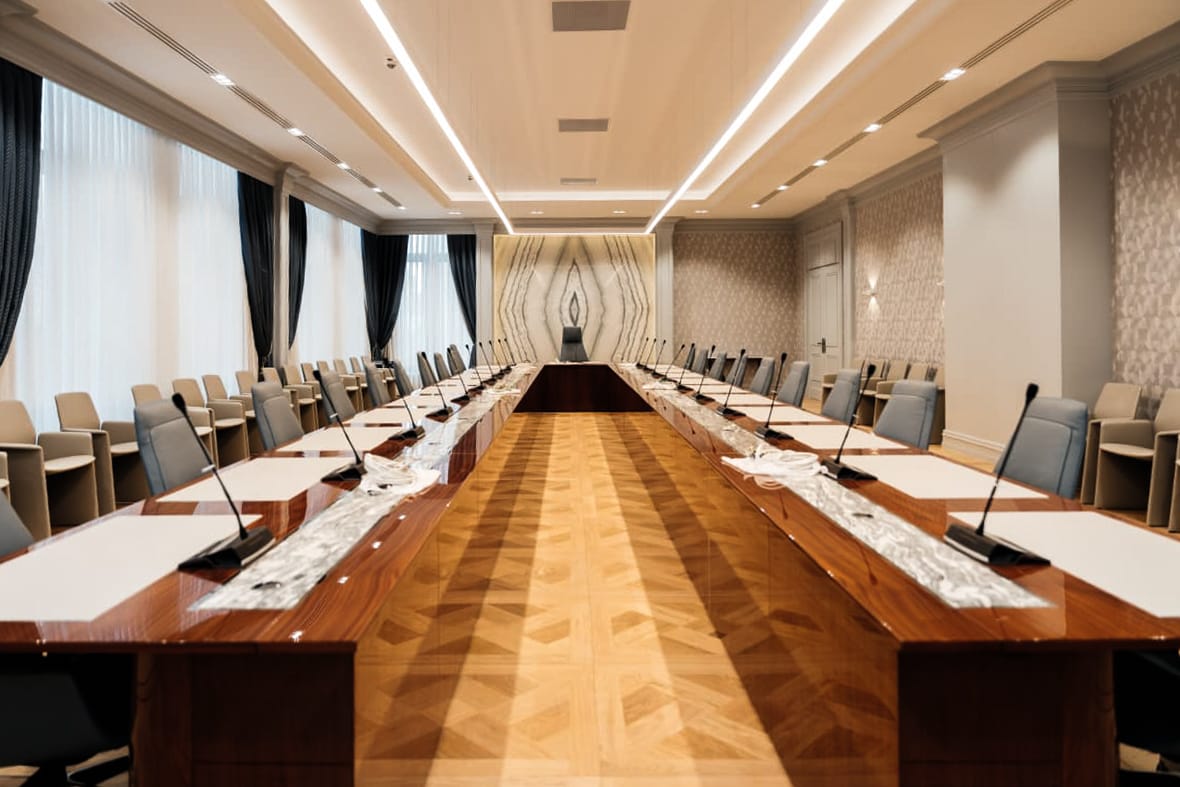 Constitutional Court — assembly hall — long tables, warm light