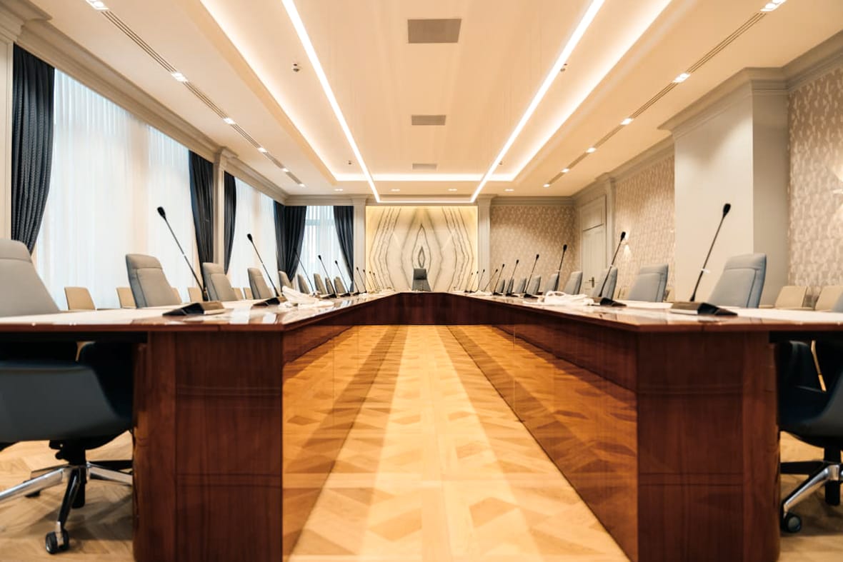 Constitutional Court — boardroom — wood table, microphones