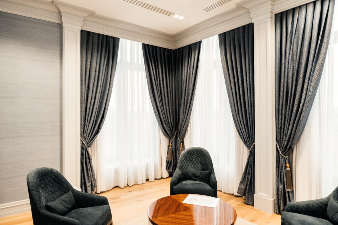 Private Bank — curtains and armchairs — daylight