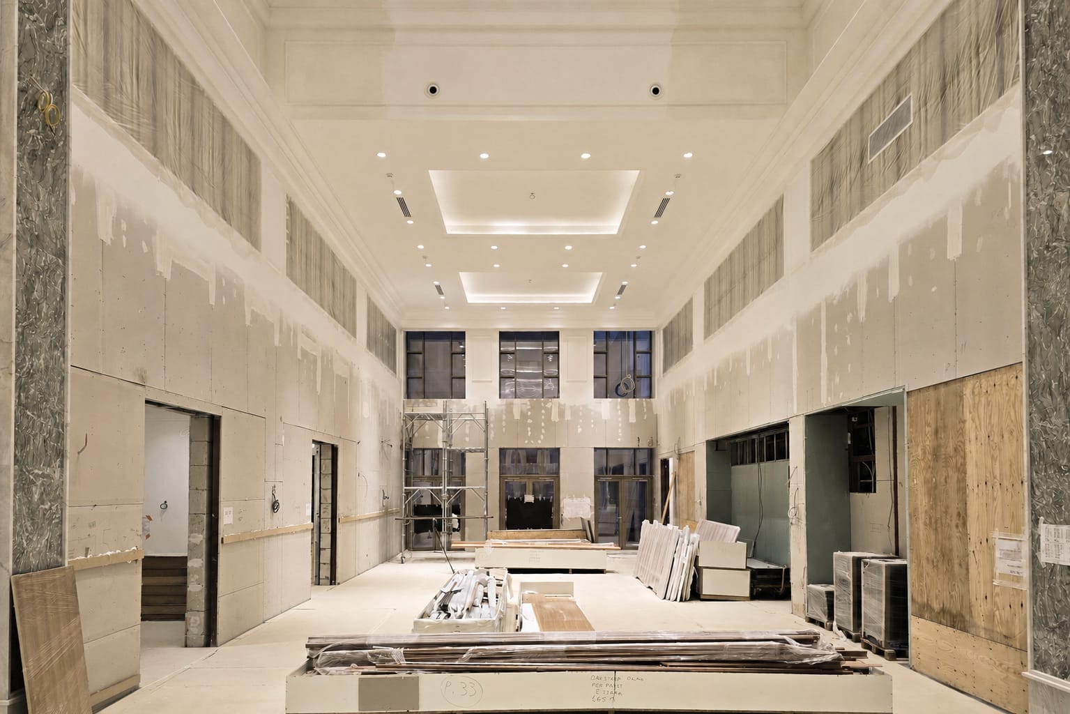 Private Bank — atrium under construction — stone and scaffold