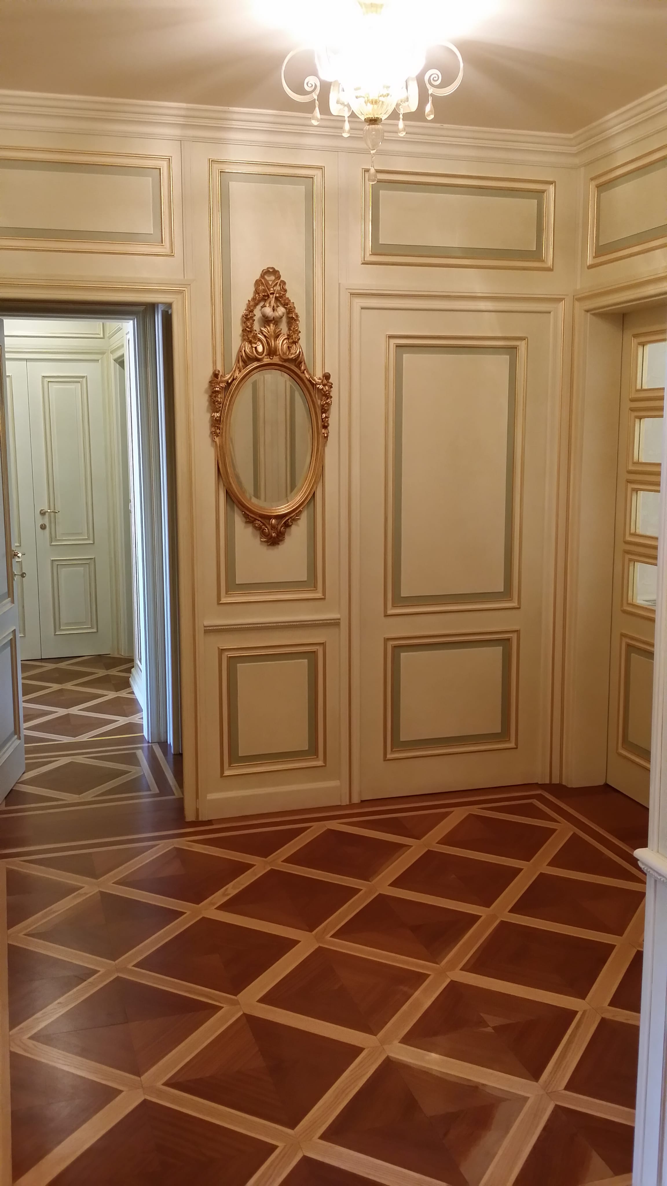 Vila 3 — classical hall — chandelier, terracotta floor